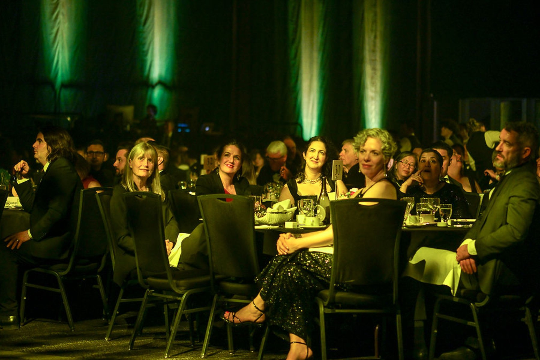  Gala guests watching the 100-year anniversary presentation. 