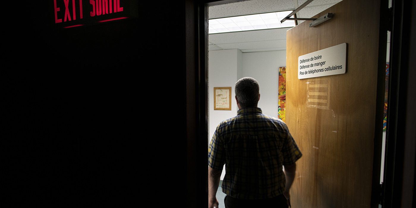 Person entering a room on the Campus Saint-Jean