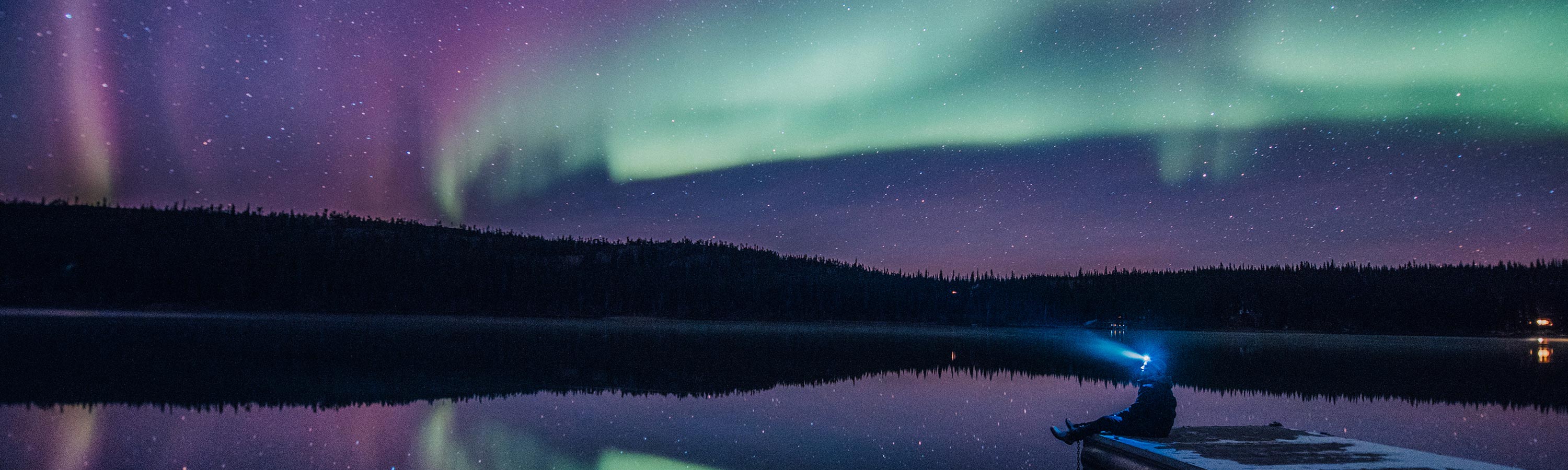 Auroras over a lake near Yellowknife