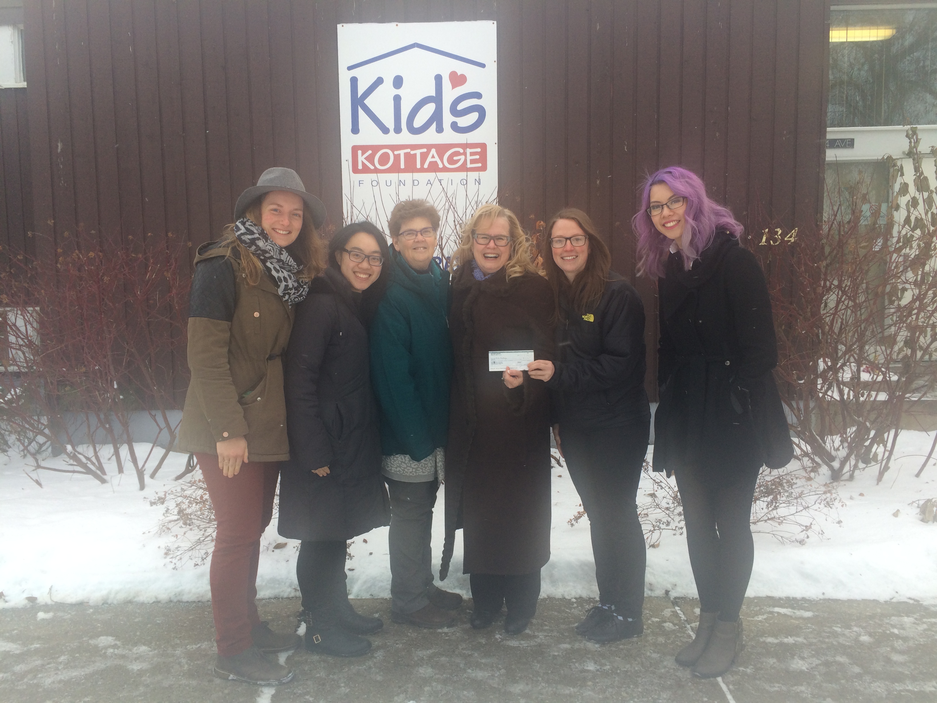 The Affair of the Heart Executive committee presents Kids Kottage Foundation with a cheque.