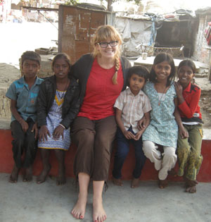Sharon Riley with Indian children at a library in Varanasi, India