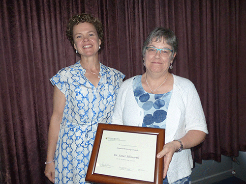 Janet Ellsworth, right, receives the 2018 Annual Mentoring Award from Susan Gilmour.